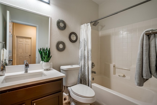 full bathroom featuring shower / bath combo, vanity, and toilet