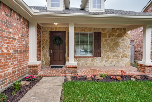 property entrance featuring covered porch