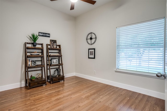 spare room with light hardwood / wood-style flooring and ceiling fan