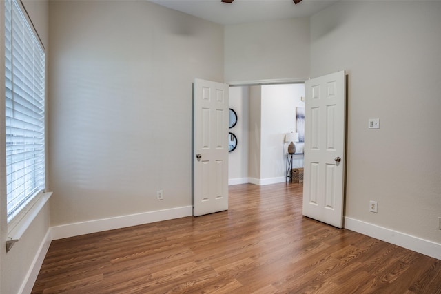 unfurnished room featuring wood-type flooring and ceiling fan