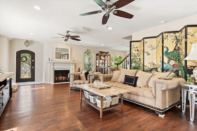 living room with dark hardwood / wood-style floors and ceiling fan