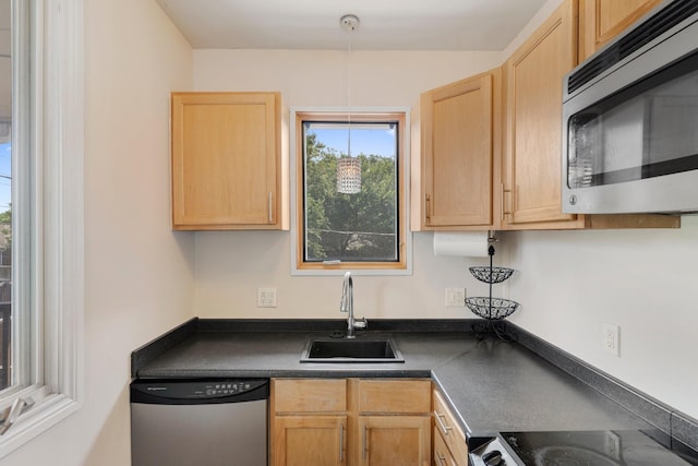 kitchen featuring sink, light brown cabinets, and appliances with stainless steel finishes
