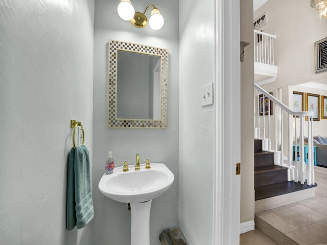 bathroom with hardwood / wood-style floors