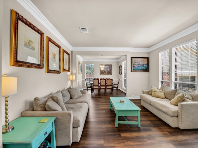 living room with dark hardwood / wood-style floors and crown molding