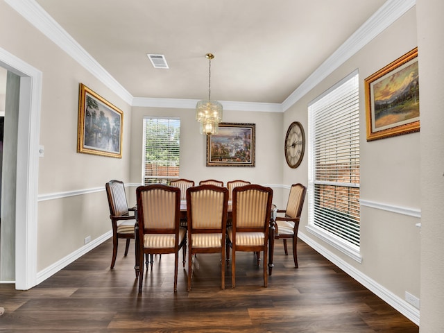 dining room with a chandelier, dark hardwood / wood-style floors, and ornamental molding