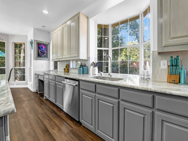 kitchen with gray cabinetry, dishwasher, sink, decorative backsplash, and dark hardwood / wood-style flooring