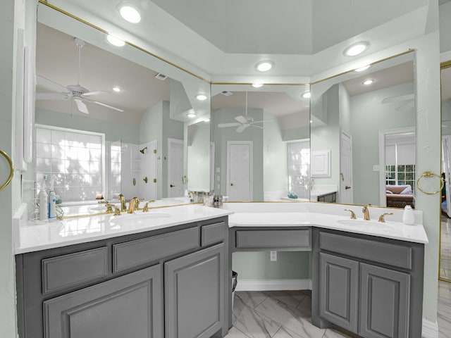 bathroom with vanity, ceiling fan, and decorative backsplash