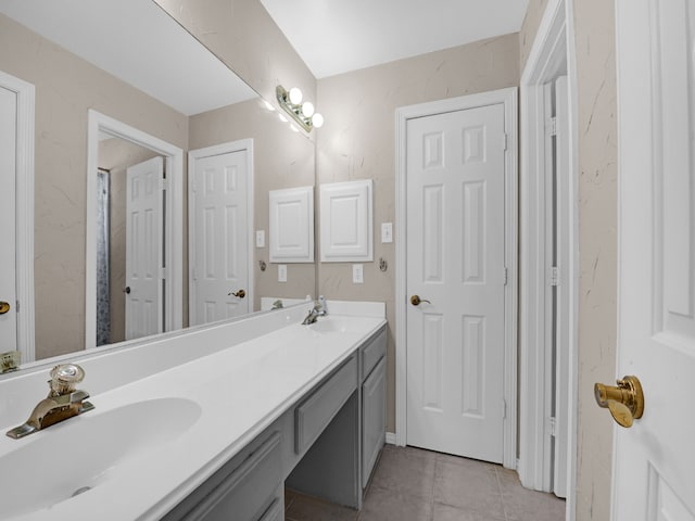 bathroom with tile patterned flooring and vanity