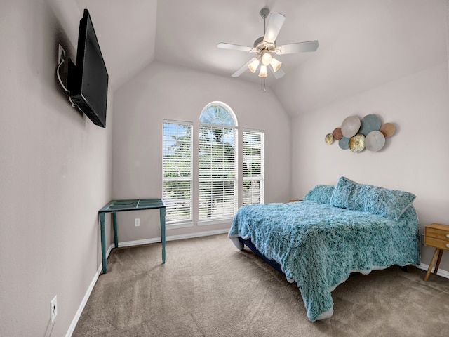 bedroom with ceiling fan, carpet floors, and vaulted ceiling