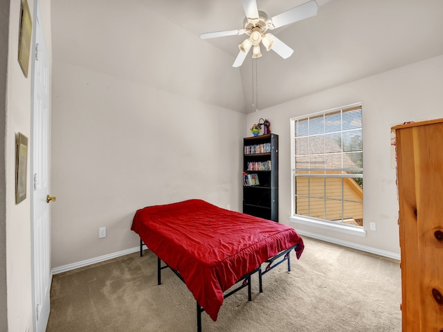 carpeted bedroom with ceiling fan and lofted ceiling