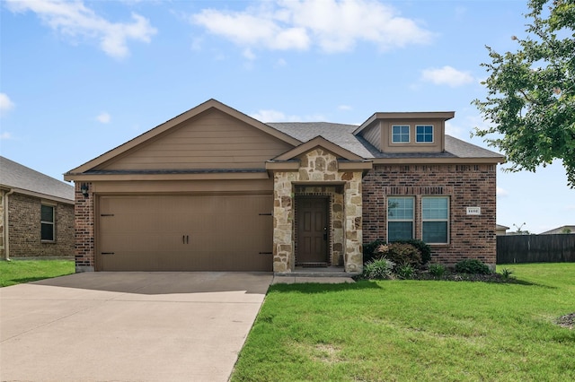 view of front of house featuring a garage and a front yard