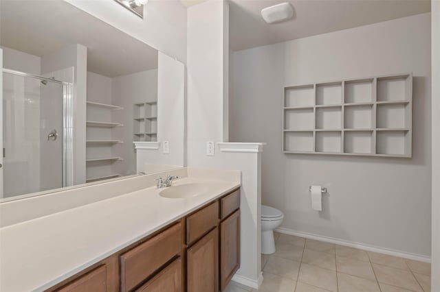 bathroom with vanity, toilet, an enclosed shower, and tile patterned flooring