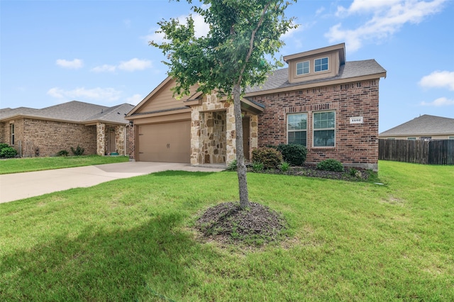 view of front of house featuring a garage and a front lawn