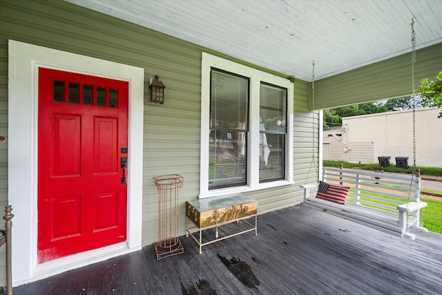 view of exterior entry with covered porch