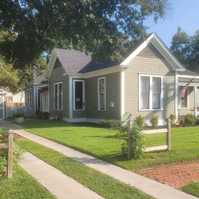 bungalow-style house with a front yard