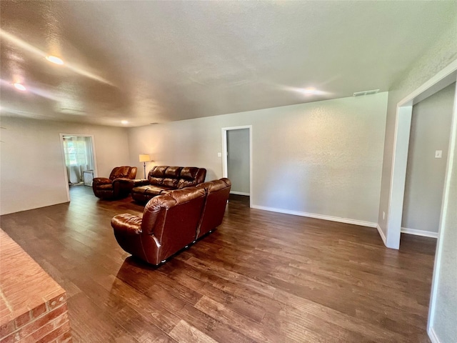 living room with dark hardwood / wood-style floors