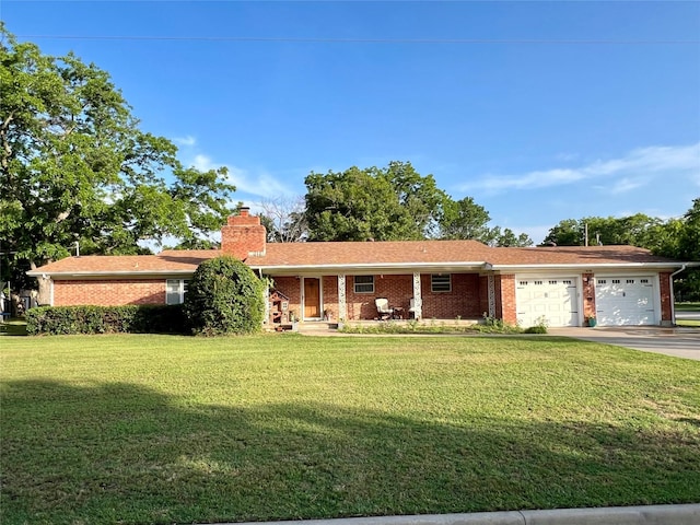 ranch-style home with a front yard and a garage