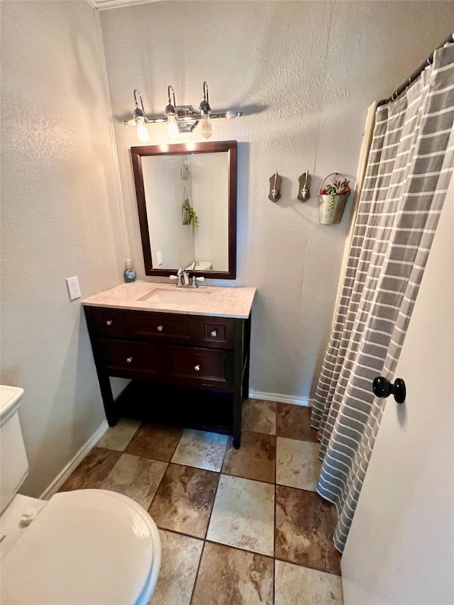 bathroom with vanity and toilet