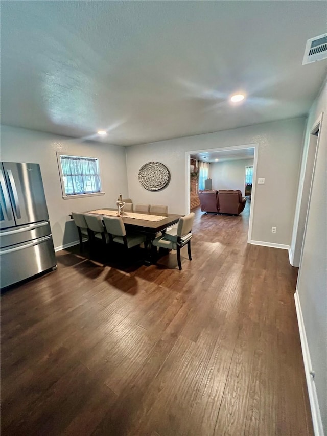 dining space featuring hardwood / wood-style flooring