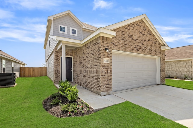 view of front of house with a garage, central AC, and a front lawn