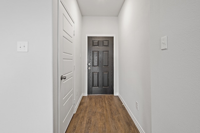 entryway with dark hardwood / wood-style floors