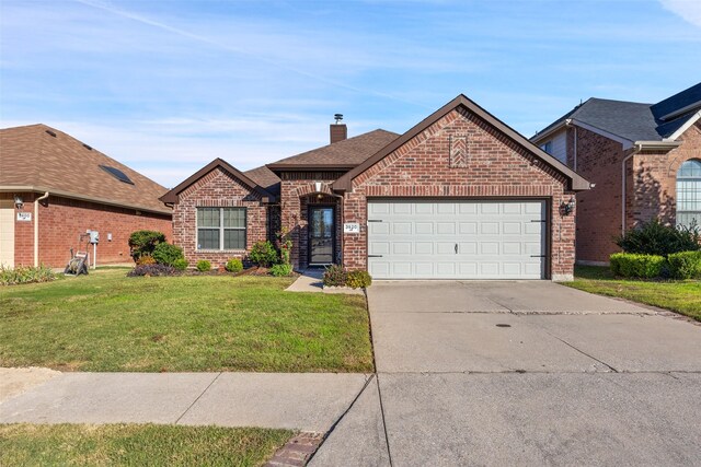 view of front property with a front lawn and a garage