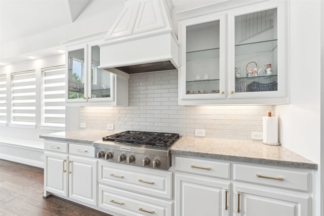 kitchen with white cabinets, custom exhaust hood, dark hardwood / wood-style flooring, and stainless steel gas stovetop