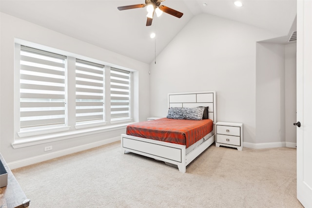 bedroom featuring ceiling fan, light carpet, and vaulted ceiling