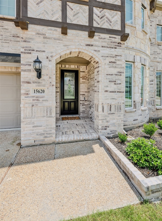 view of exterior entry featuring a garage