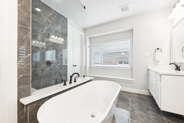 bathroom with vanity and a tub to relax in