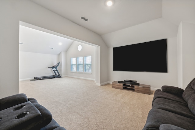 carpeted living room featuring lofted ceiling