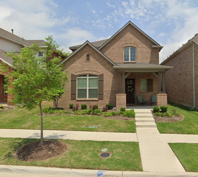 view of front of home featuring a porch and a front yard