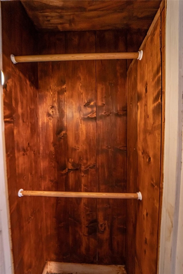 interior details featuring wooden walls and wooden ceiling