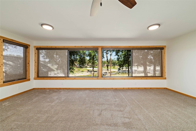 carpeted empty room with ceiling fan