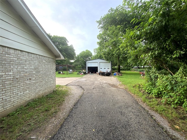 exterior space with a garage and an outdoor structure