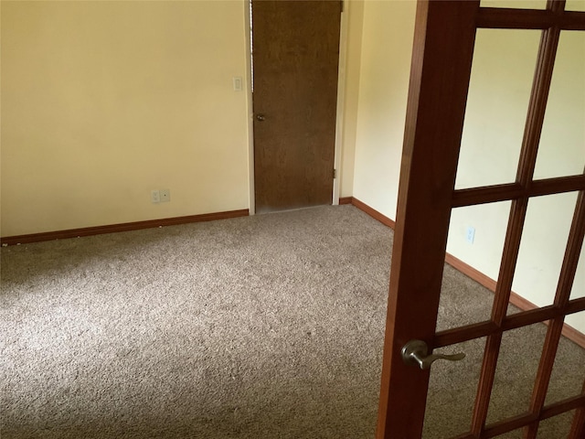 unfurnished room featuring carpet floors