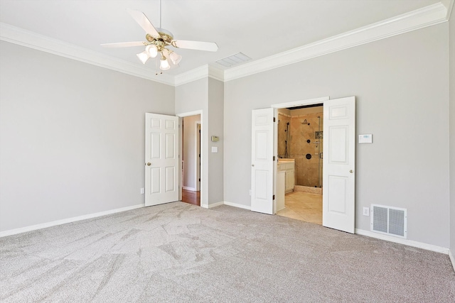 unfurnished bedroom with ceiling fan, crown molding, light carpet, and ensuite bathroom