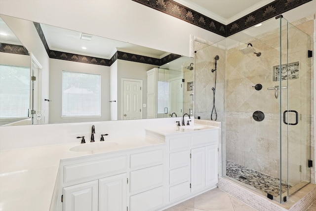 bathroom featuring an enclosed shower, crown molding, vanity, and tile patterned floors