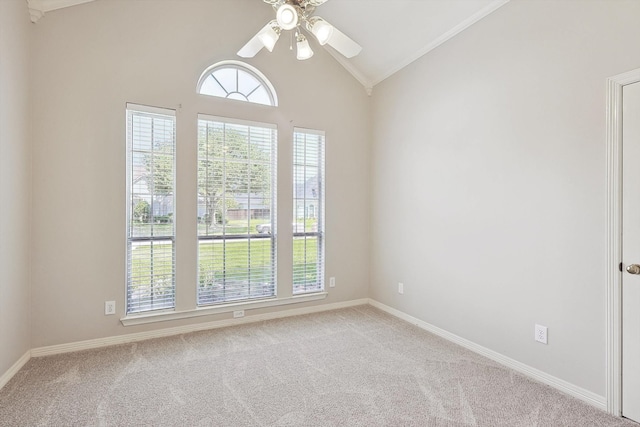 unfurnished room featuring plenty of natural light, ceiling fan, light carpet, and lofted ceiling