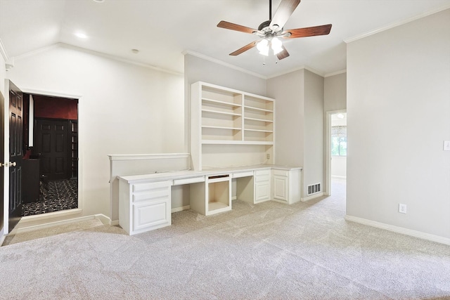 interior space with ceiling fan, light carpet, crown molding, and lofted ceiling