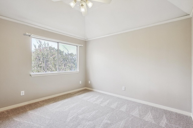 carpeted empty room with ceiling fan, lofted ceiling, and crown molding