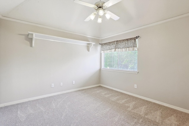 carpeted empty room featuring ceiling fan and ornamental molding