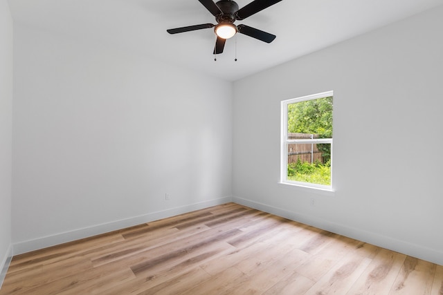 unfurnished room with ceiling fan and light hardwood / wood-style floors