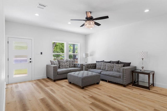 living room featuring ceiling fan and light wood-type flooring