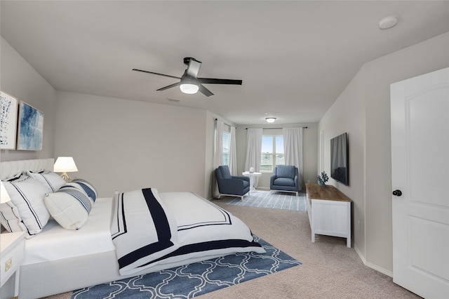 carpeted bedroom with ceiling fan