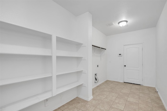 bedroom featuring light colored carpet and ceiling fan