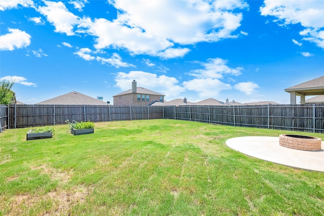 view of yard featuring a fire pit and a patio area