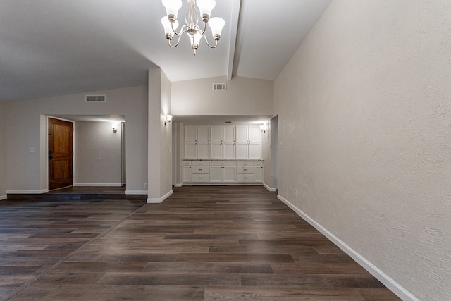 interior space with vaulted ceiling with beams, dark hardwood / wood-style floors, and a notable chandelier