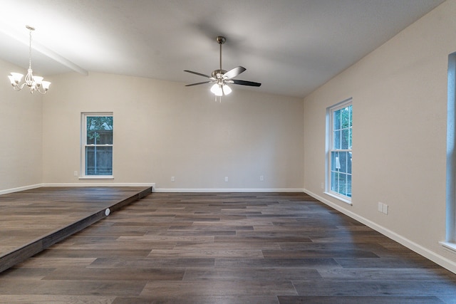 spare room featuring ceiling fan with notable chandelier, vaulted ceiling with beams, and dark wood-type flooring