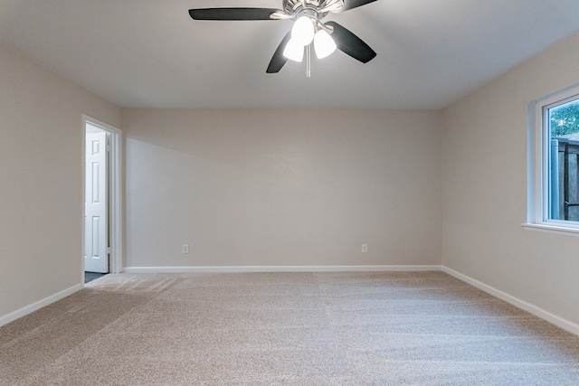 carpeted empty room with ceiling fan